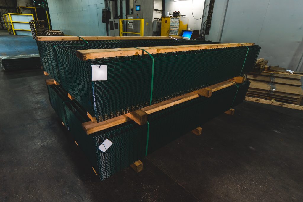 Coated fence panels wrapped and palletised for distribution