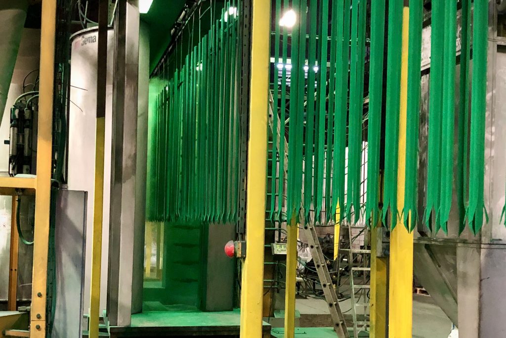 Green powder coated fence panels on the Northpoint coating line