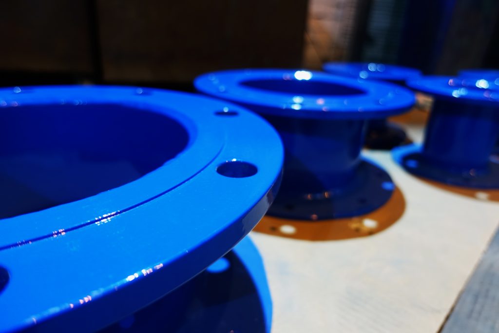 Pipe fittings finished in blue FBE coating